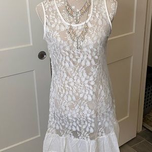 This a white tank however I wore it once with teddy or can be worn over anything